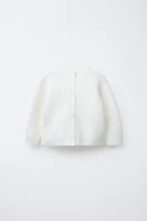 PULL EN MAILLE AVEC POCHE