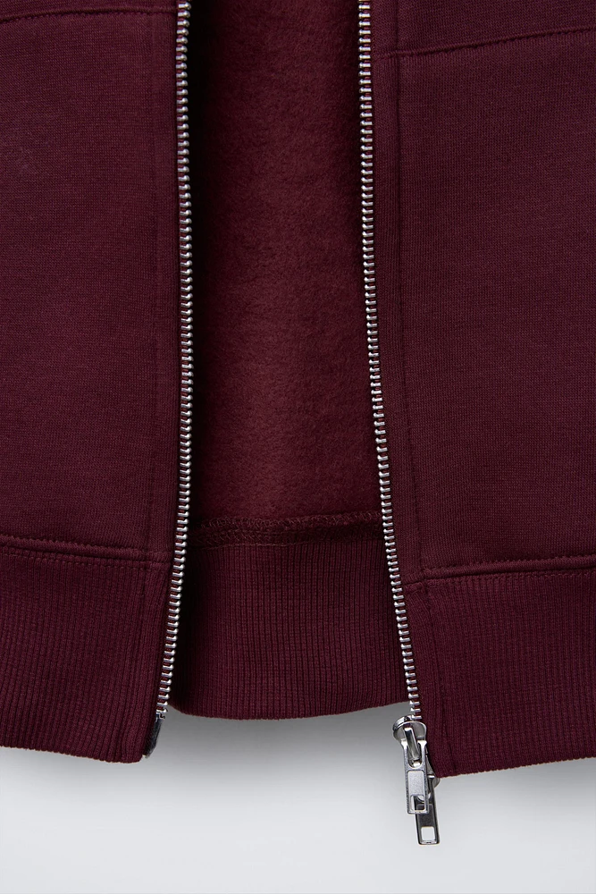 SWEAT À CAPUCHE ET ZIP