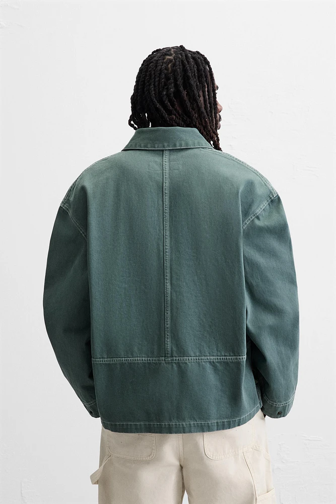 VESTE DÉLAVÉE SURPIQÛRES CONTRASTÉES