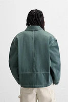 VESTE DÉLAVÉE SURPIQÛRES CONTRASTÉES