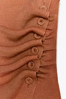 OFF-THE-SHOULDER RUCHED KNIT TOP
