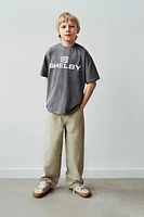 T-SHIRT EFFET DÉLAVÉ AVEC INSCRIPTION IMPRIMÉE