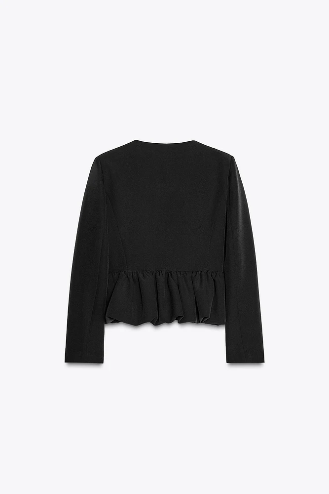 VESTE AVEC BAS VOLUMINEUX