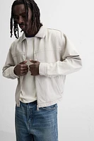 VESTE EN JEAN AVEC COL MATIÈRES VARIÉES