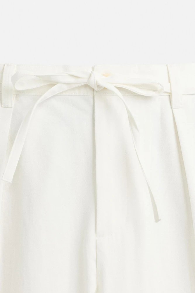 RELAXED FIT PLEATED PANTS