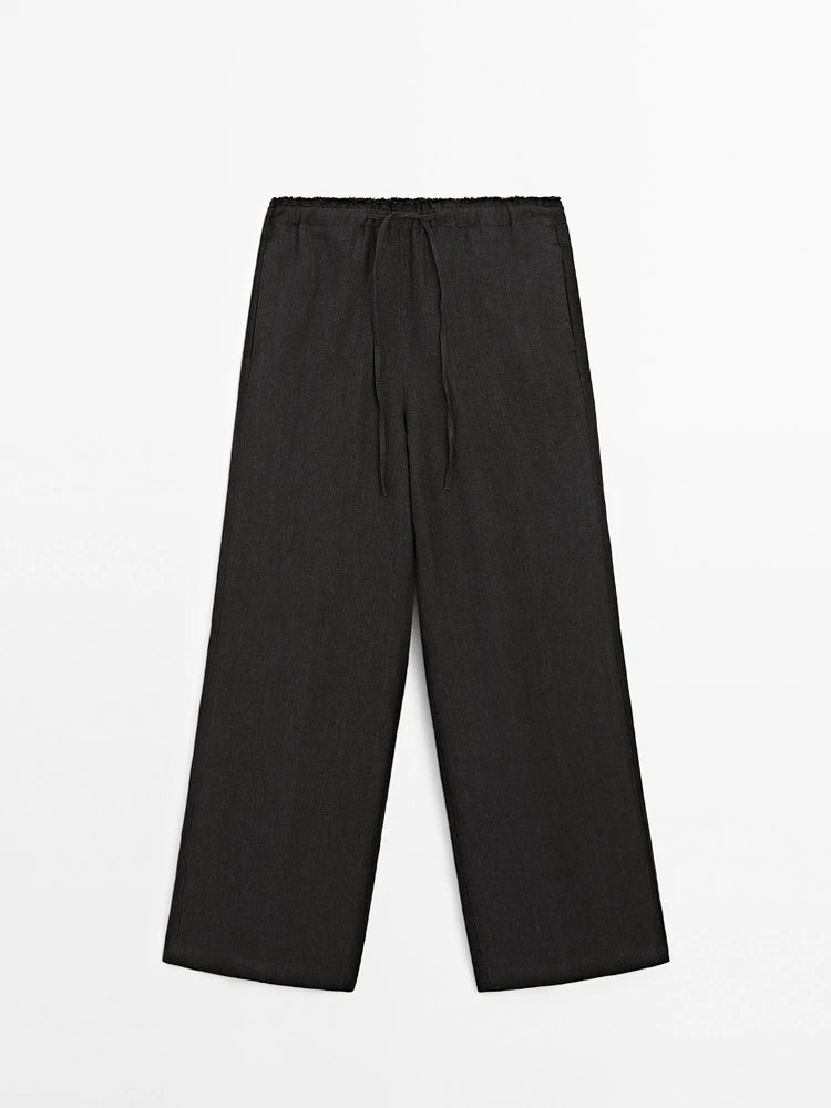Linen suit trousers with frayed detail