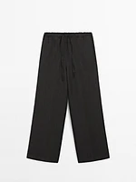 Linen suit trousers with frayed detail