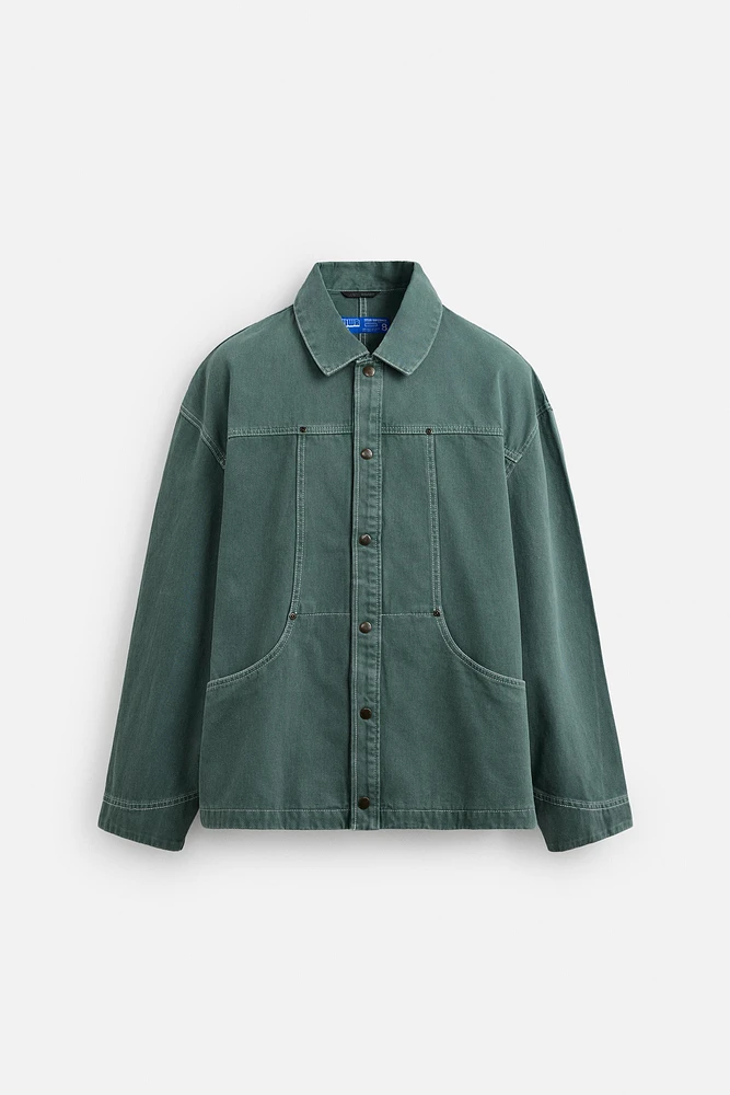 VESTE DÉLAVÉE SURPIQÛRES CONTRASTÉES