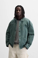 VESTE DÉLAVÉE SURPIQÛRES CONTRASTÉES