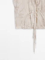 Gathered top with tie fastening