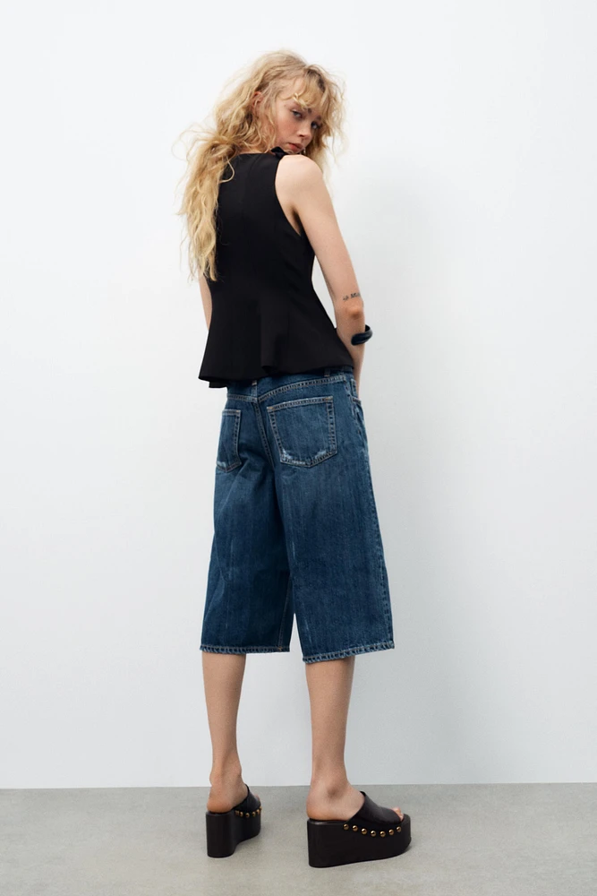 TOP PÉPLUM À LACETS