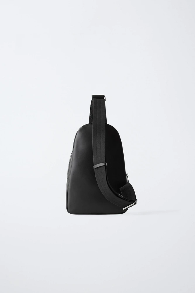 EMBOSSED CROSSBODY BACKPACK
