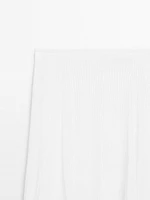Pleated skirt with godet detail