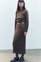 LONG PULL EN MAILLE TRESSÉE AVEC LAINE