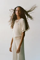 PULL EN MAILLE À TORSADES