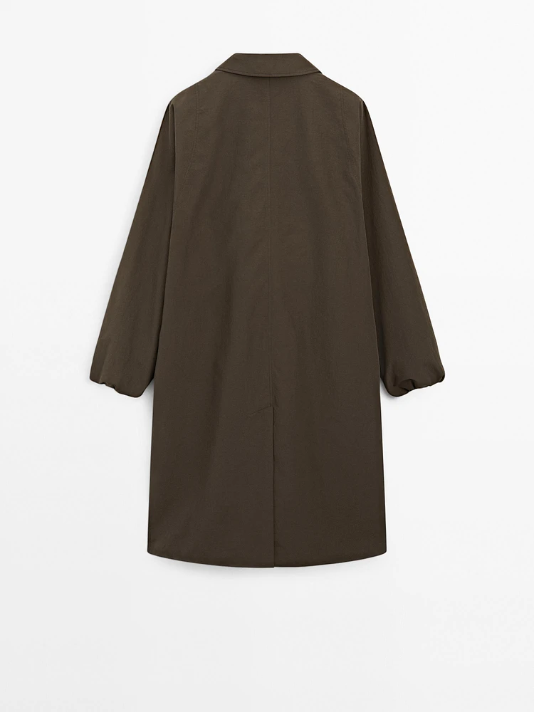Technical fabric trench coat with button detail