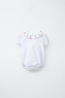 EMBROIDERED NECK BODYSUIT