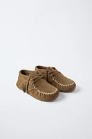 BOTTES EN CUIR À FRANGES