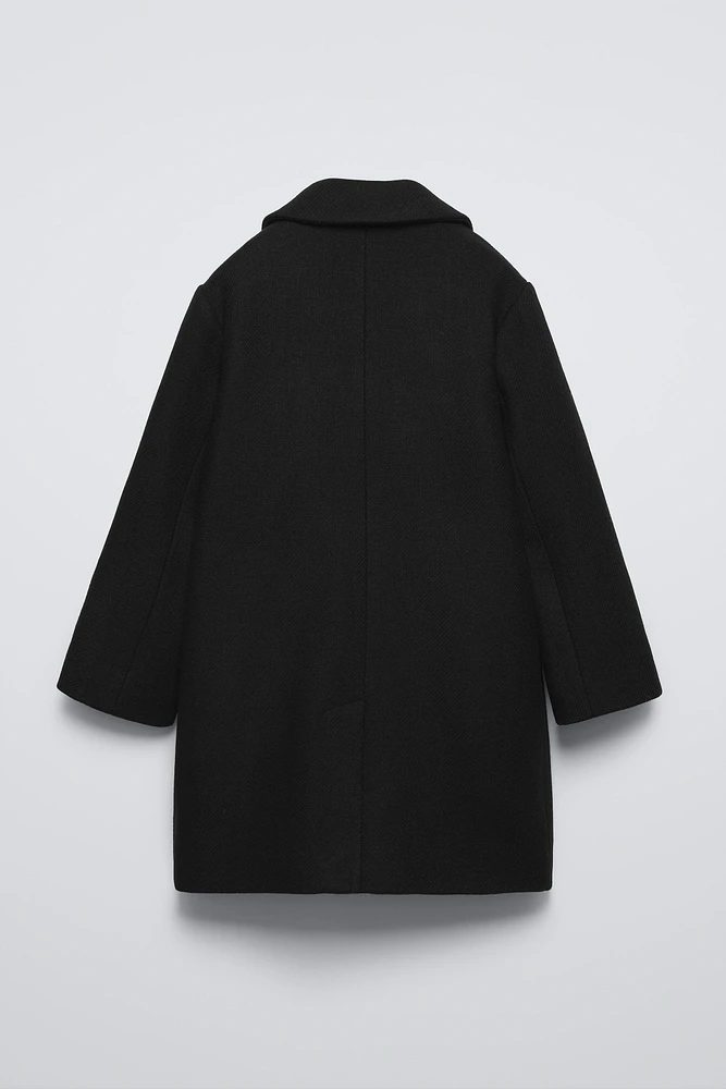 MANTEAU CONTENANT DE LA LAINE