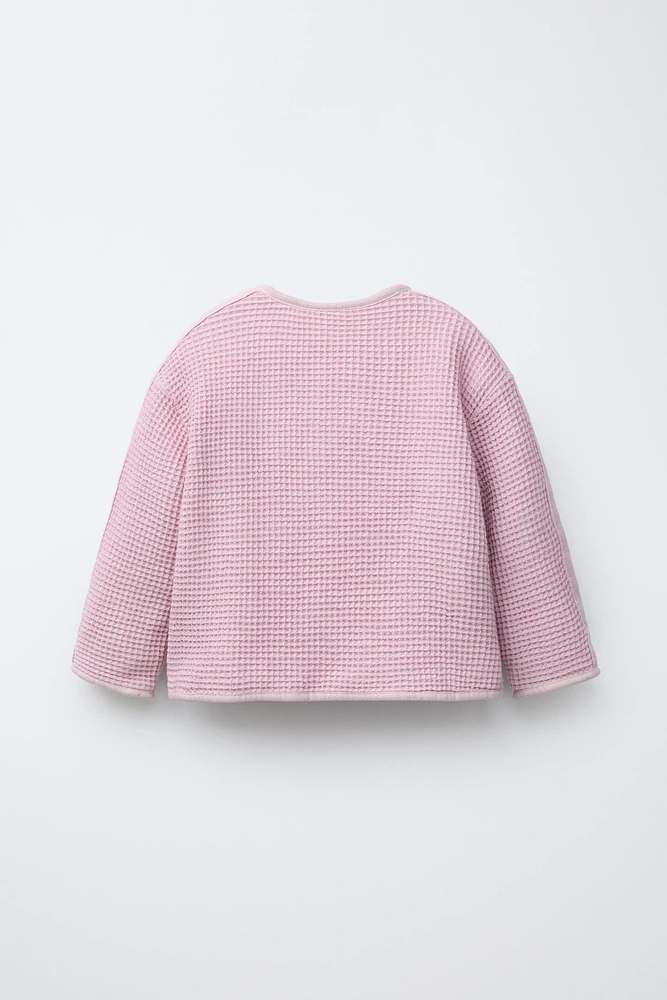 VESTE GAUFRÉE À BOUTONS