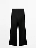 Pantalon flare satiné et fendu