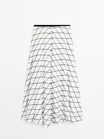Jupe midi ample évasée à carreaux