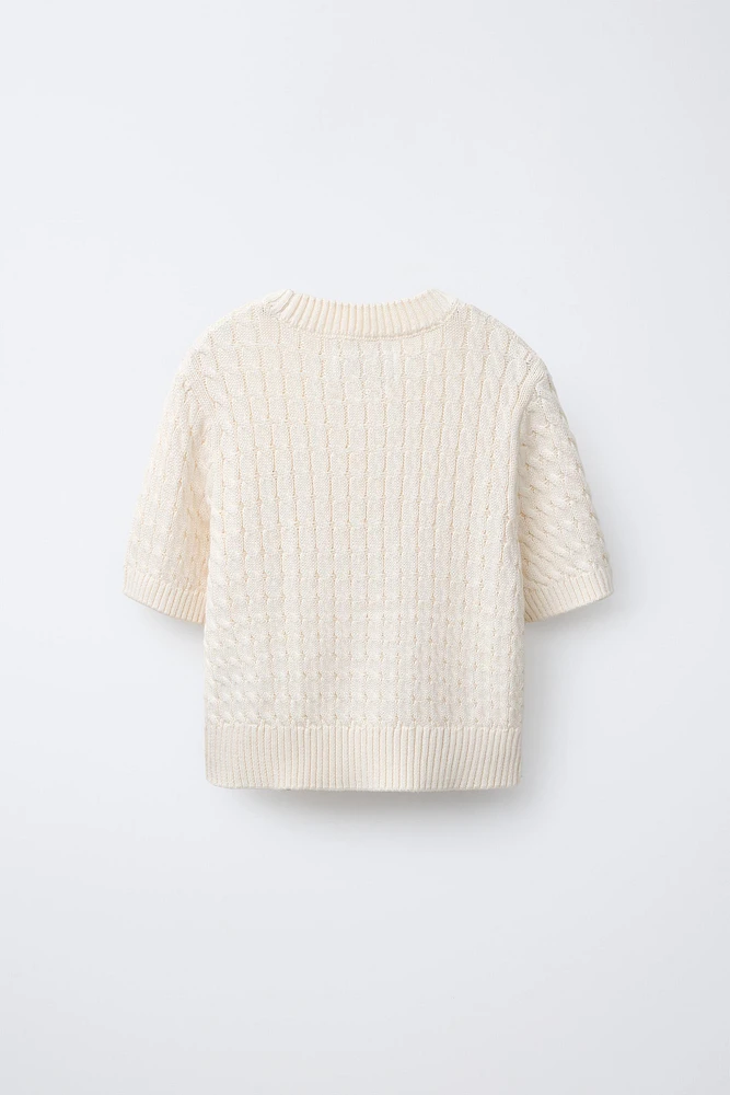 PULL EN MAILLE À TORSADES