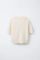 PULL EN MAILLE À TORSADES