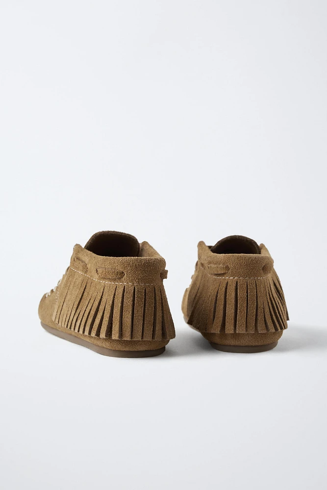 BOTTES EN CUIR À FRANGES