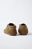 BOTTES EN CUIR À FRANGES
