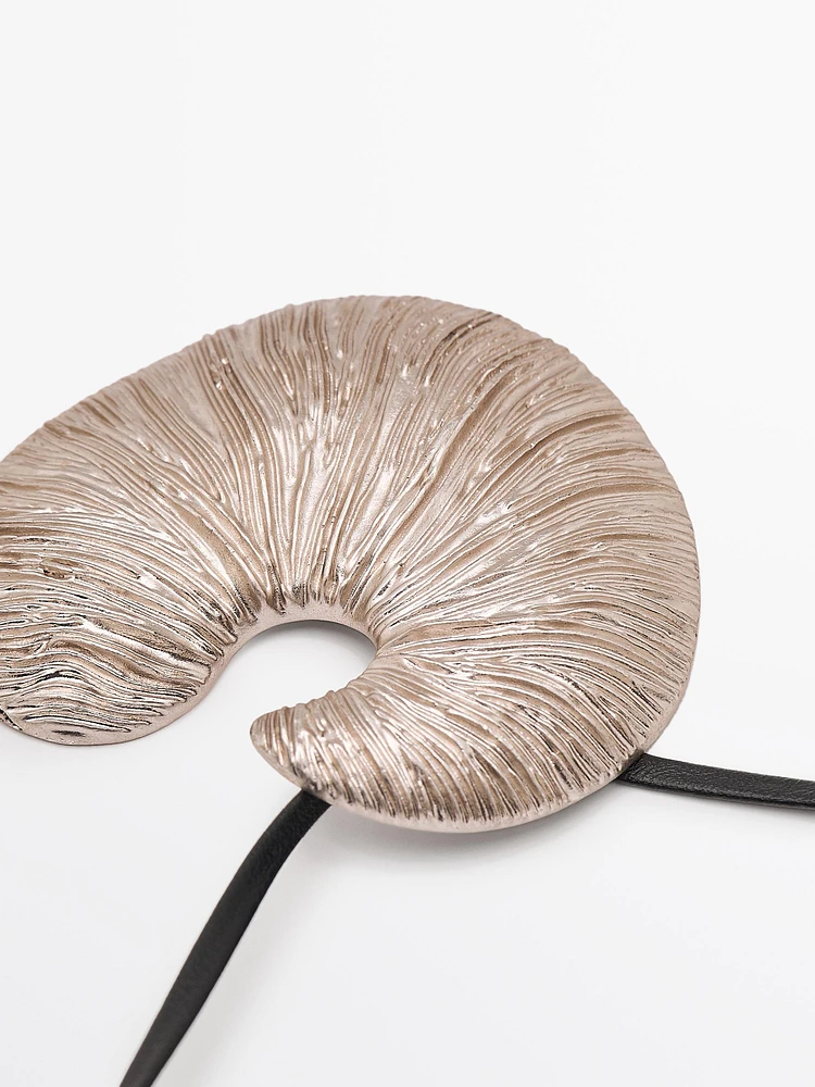 Necklace with fossil piece pendant