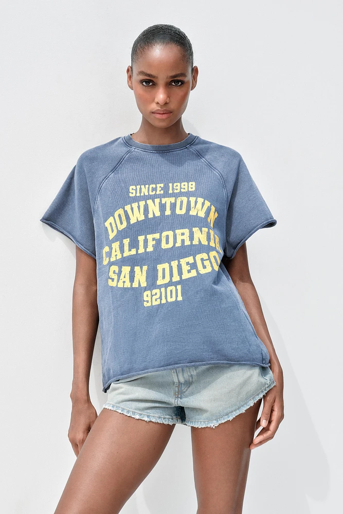 WASHED EFFECT TEXT PLUSH SWEATSHIRT
