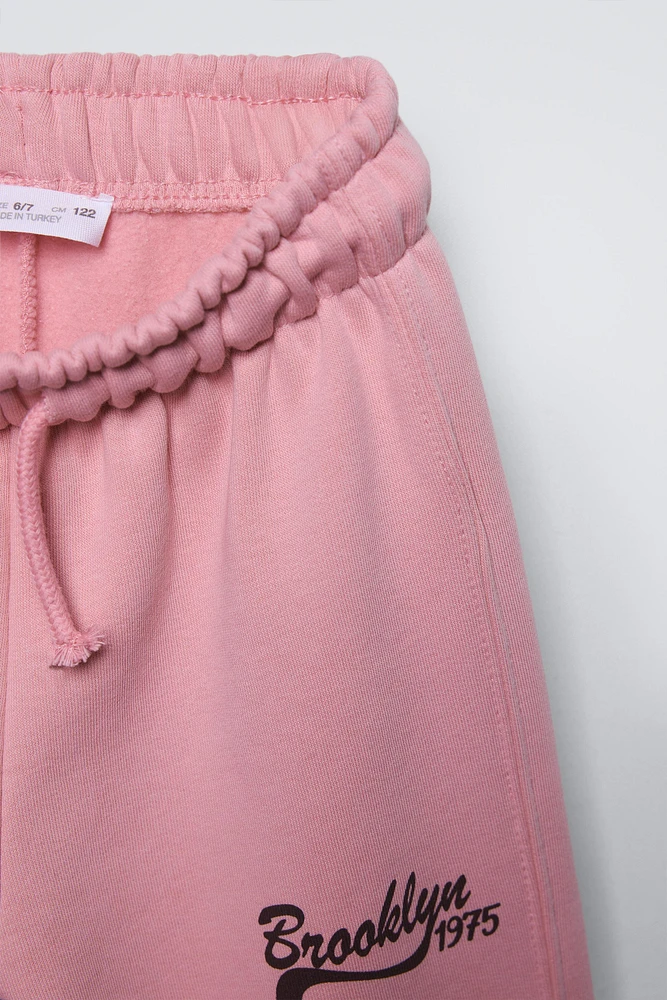 PLUSH WIDE LEG TEXT PANTS