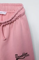 PLUSH WIDE LEG TEXT PANTS