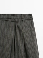 Multi-stripe trousers with belt detail