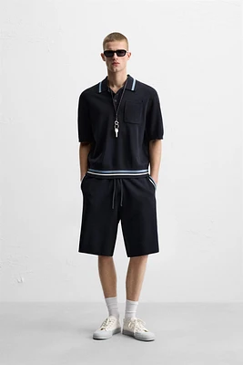 POLO EN MAILLE À POCHE