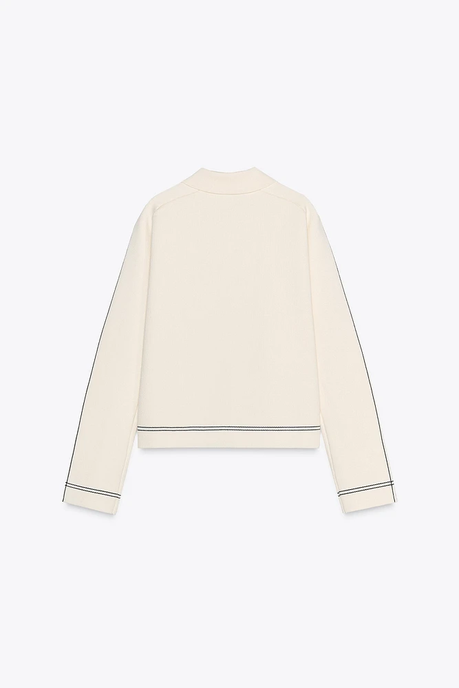 VESTE EN MAILLE À LISERÉS