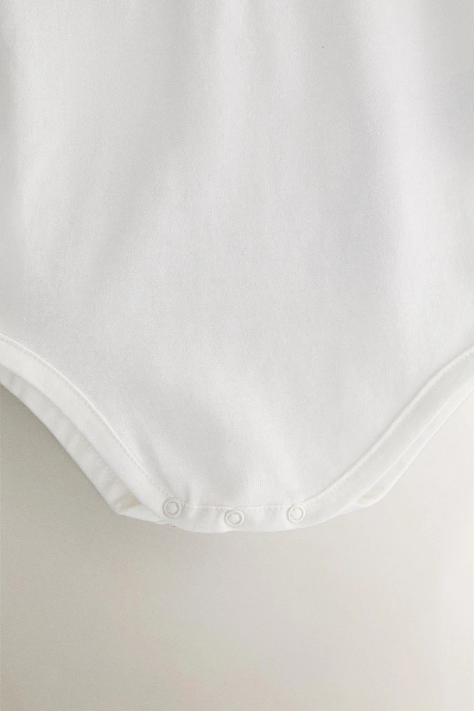 CHILDREN'S BODYSUIT WITH FLORAL EMBROIDERY