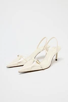 VINYL BUCKLE SLINGBACKS