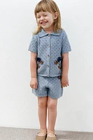 POLO EN MAILLE À FLEURS CROCHET