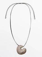 Necklace with fossil piece pendant