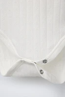 THREE-PACK OF SHORT SLEEVE BODYSUITS WITH TWIGS