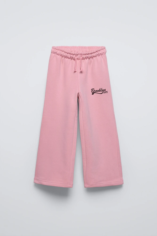 PLUSH WIDE LEG TEXT PANTS