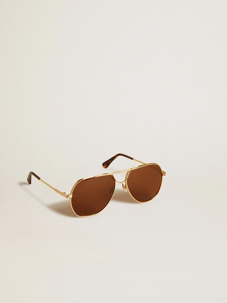 Aviator style sunglasses with gold frame and brown lenses