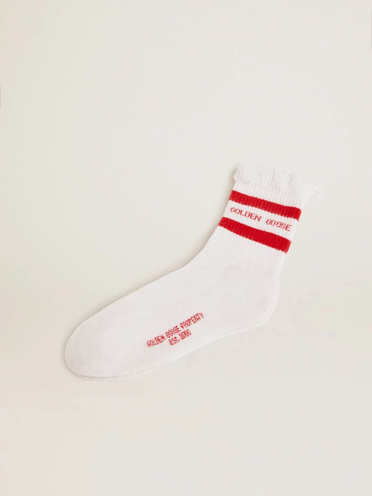 White socks with distressed details and red stripes