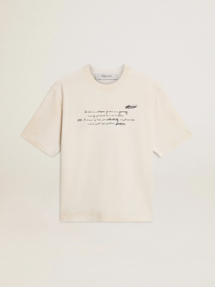 Worn-white unisex T-shirt with printed lettering