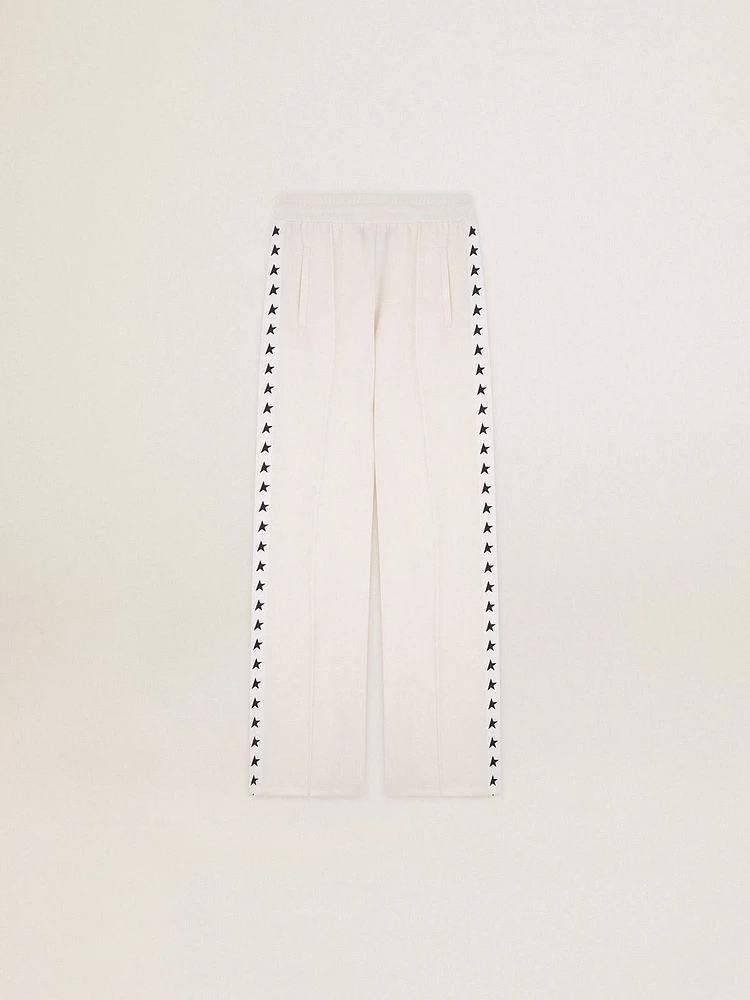 Women’s white joggers with stars on the sides
