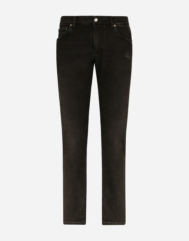 Slim fit stretch denim jeans with subtle abrasions