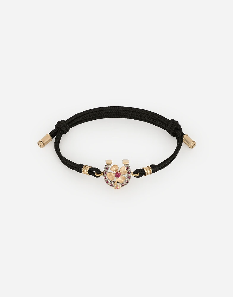 Good Luck Bracelet fabric with a pendant in 18 carat yellow gold