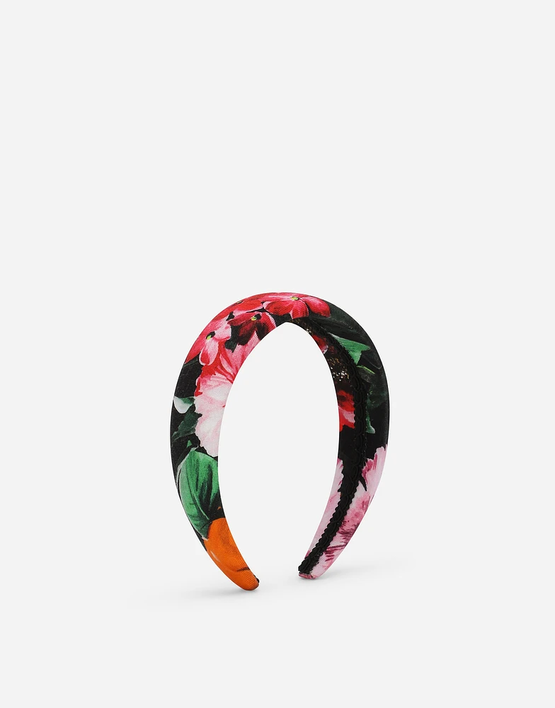 Viyella hairband with floral print over a black background